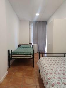 a room with two beds in a room at Nest Room in Alicante