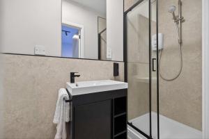 a bathroom with a sink and a shower at Sanctuary Hotel - En Suite Rooms in Aberdeen