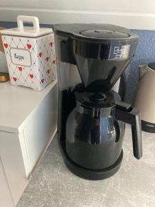 a coffee maker sitting on top of a counter at Private country side apartment in Holstebro