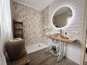 a bathroom with a sink and a mirror at Apartamento La Bruma 30807 in Somo +12 photos