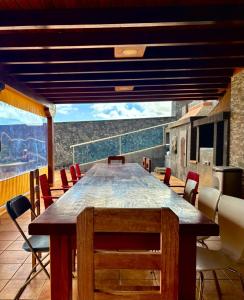 a table and chairs on a balcony with a view at Villa en el Time con piscina in Puerto del Rosario