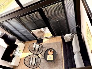 a room with two windows and a table with a donut on it at Wczasowy Loft Sominy in Sominy