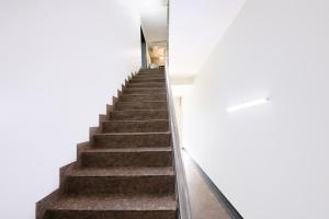 a stairway leading up to a white building at FabHotel The Fortune in New Delhi