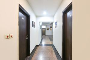 a hallway with two sets of doors and a hallway with a hallway at FabHotel The Fortune in New Delhi