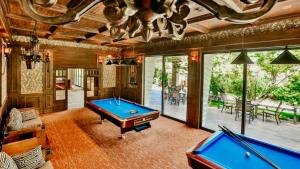 a room with a pool table in a house at Dreamland Aparts in Chakvi