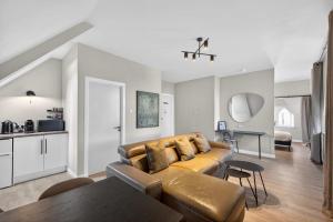 a living room with a couch and a table at Sanctuary Hotel - En Suite Rooms in Aberdeen +15 photos