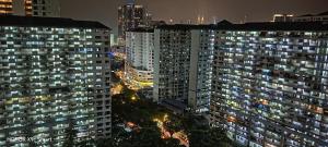 a view of a city at night with tall buildings at Hot Spring Residential B in Kuala Lumpur