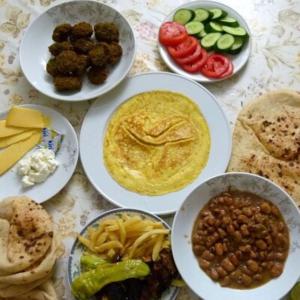 a table topped with plates of food with different foods at 1Water Lily in Luxor +9 photos