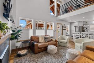 a living room with a couch and a chair at Comfy & close to Lake Pend Oreille & Schweitzer in Dover +30 photos