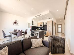 a living room with a couch and a table at St Julians - Spinola Space by DNA in St. Julianʼs