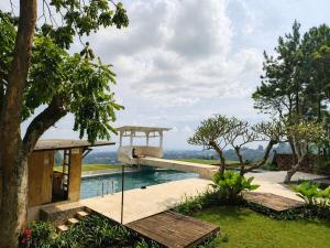 a house with a view of the water at Dulang Resort & Resto in Bongkar 2