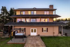 a large house with a driveway in front of it at Spacious Gracious & Luxurious Retreat in Westport
