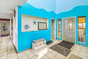 a living room with a blue wall at Spacious Gracious & Luxurious Retreat in Westport +50 photos