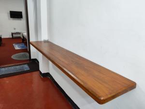 a wooden rail on a wall in a room at Sri VK Residency - Buget Friendly Colombo Hotel in Colombo