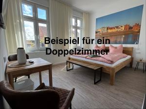 a living room with a couch and a table at Downtown 38 in Wittenberge