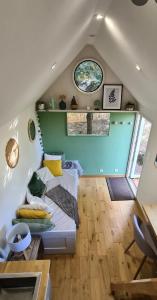 a small room with a bed and a window at Tiny House Bord de Mer in Plouarzel