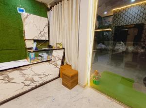 a entrance to a room with a green wall at shree krishna Hotel in Ujjain
