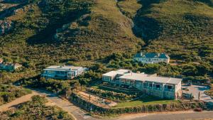 an aerial view of a house with a mountain at Whale Coast Luxury Suites in Hermanus