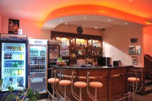 a bar in a restaurant with two refrigerators at Семеен Хотел Сокол in Sandanski