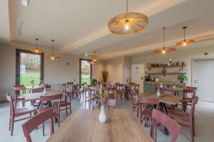 a dining room with wooden tables and chairs at Agriturismo Bramalpane in Bagno di Romagna