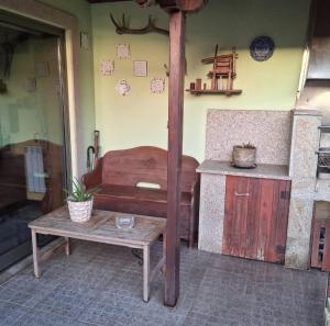 a room with a bed and a table and a counter at Praia Espinho in Espinho +6 photos