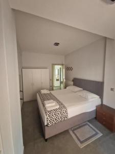 a bedroom with a large bed in a room at Liliana's house in Kallithea Halkidikis