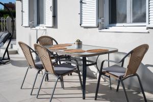 a table and chairs on a patio at Memoa Residence Preveza in Preveza +23 photos