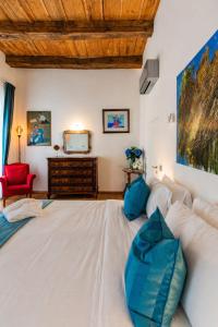a large white bed in a room with a couch at Como Icon Centro Apartment By Icon7 Luxury in Como