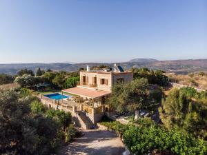 an aerial view of a house with a pool at Villa Gianna by PosarelliVillas in Fílippos