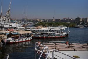 a group of boats docked in a harbor at Nuba Nest in Aswan