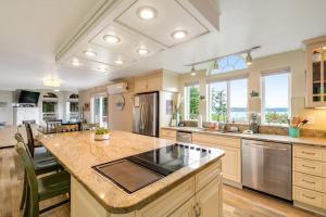 a large kitchen with a large island in the middle at Driftwood Hideaway in Indian Beach