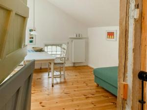 a kitchen with a table and a dining room at Apartment In A Converted 1875 Creamery in Travenhorst