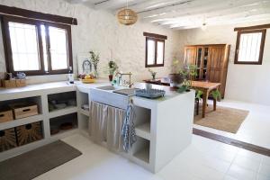 a kitchen with a sink and a counter top at casa mushin in Useras +45 photos