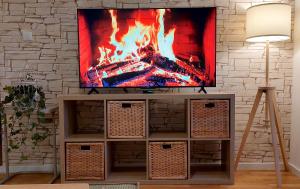 a tv sitting on top of a entertainment center at My Life 20 - Green Hill in Soko Banja