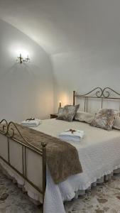 a bedroom with two beds with pillows on them at Lacerno Rooms in Pescosolido