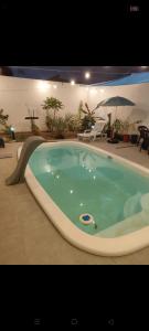 a jacuzzi tub in the middle of a house at Casa moderna em Itapoá SC in Itapoa