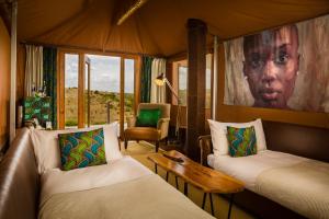 A bed or beds in a room at Mahali Mzuri