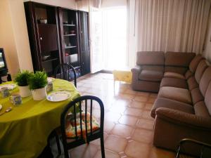 a living room with a couch and a table at San Marco Appartament in Grado