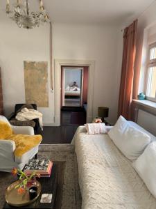 a living room with a couch and a table at Südfrankreich bei Berlin in Werder