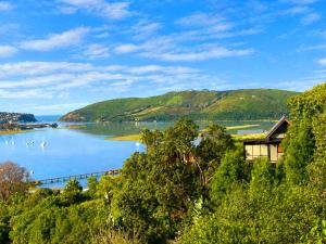 a view of a lake with mountains in the background at Paradise Private Zen Studios in Knysna