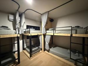a room with two bunk beds in it at Jupiter Hostel in Ban Khlong Haeng +52 photos