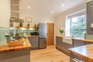 a kitchen with stainless steel appliances and a window at 3 Bed in Dingwall oc-m39032 in Dingwall