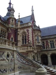 an old building with a staircase in front of it at maison entière in Fécamp