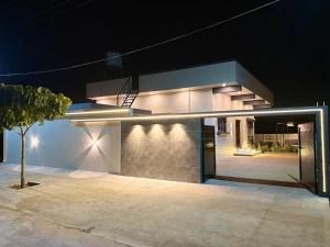 a building with a basketball hoop on top of it at night at Sunset Villa in Mysore