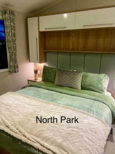 a bed in a bedroom with a north park at Hudsons Pad Sandybay in Newbiggin-by-the-Sea