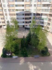 an aerial view of a park in front of a building at New House Strișca in Chişinău