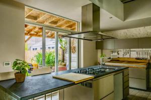 a kitchen with a counter with a stove top oven at City Loft I Fireplace I Free Parking I Garden Bath in Nieuwpoort