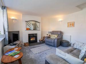 a living room with a couch and a fireplace at Mill View in York