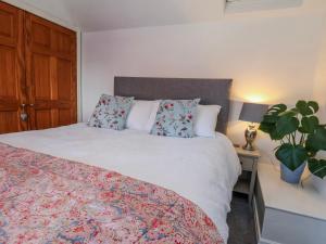 a bedroom with a bed and a potted plant at Mill View in York