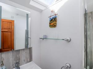 a bathroom with a sink and a mirror at Mill View in York +25 photos